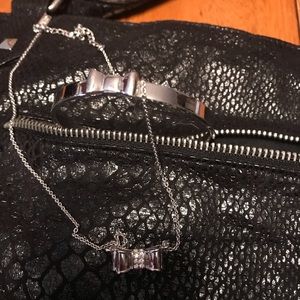 Kate Spade bow necklace with matching bracelet.